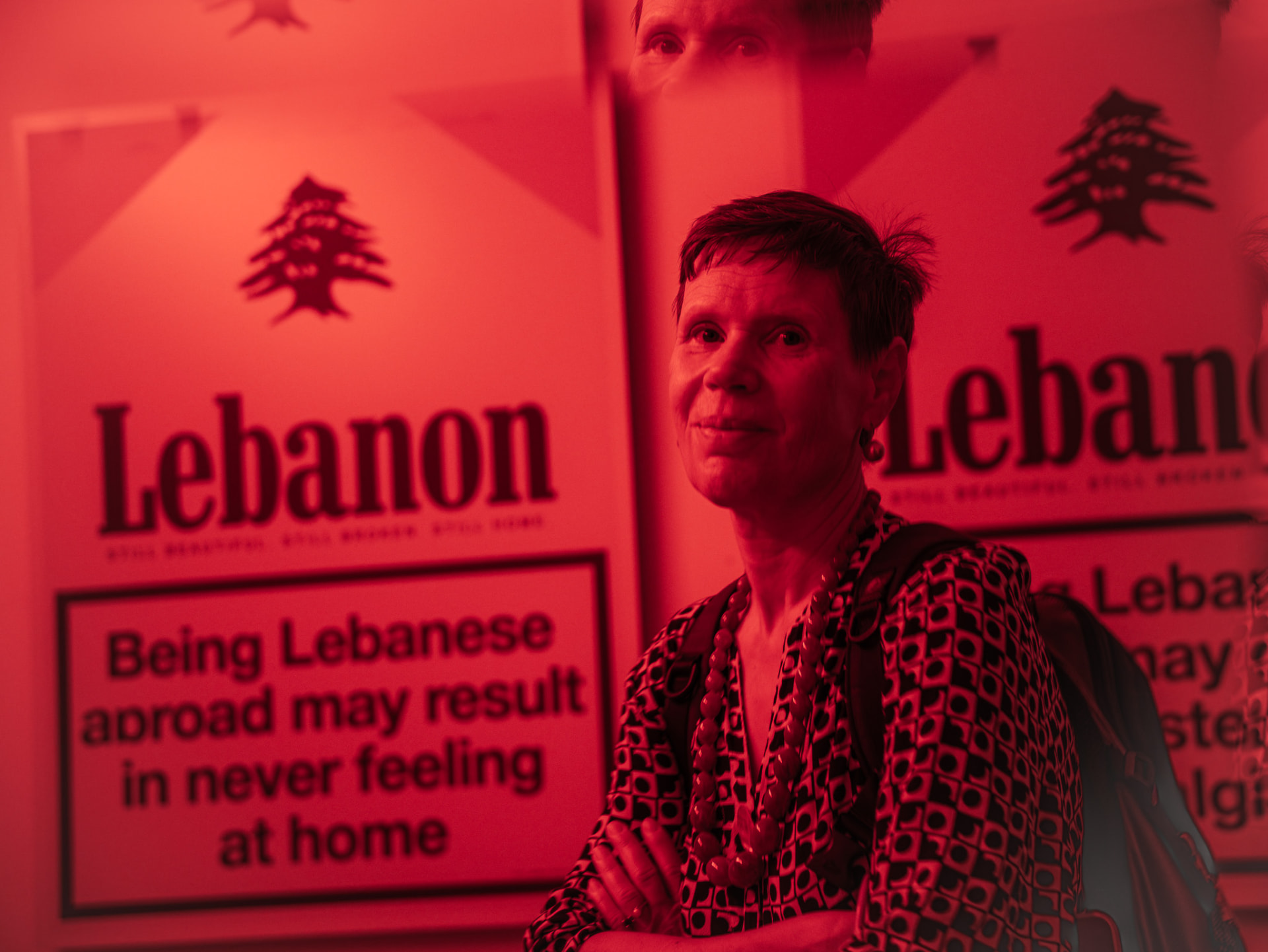 Portrait of a guest in front of 'Being Lebanese abroad may result in never feeling at home'